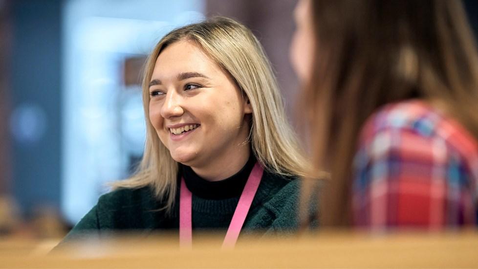 Reckitt employees around a table in conversation