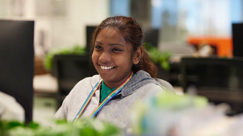 Girl Smiling While Sitting In An Office