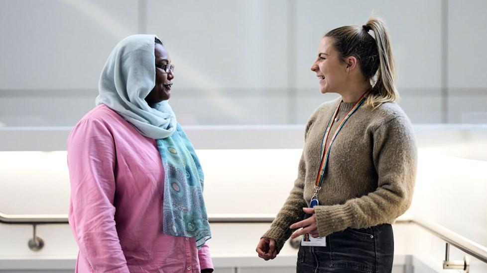 Two female Reckitt colleagues talk in the Hull office.